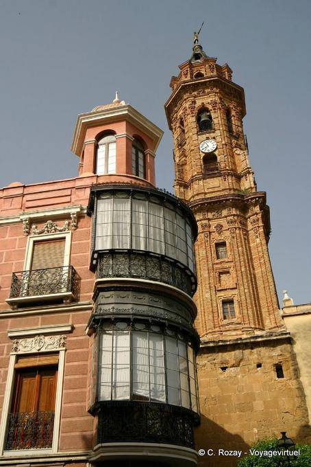 Rounded balconies in the Plaza de San Sebastián and bell tower of the Iglesia San Sebastián, Antequera - Spain