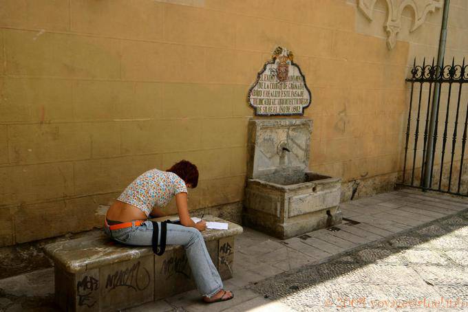 Student front of the fountain, Granada - Spain