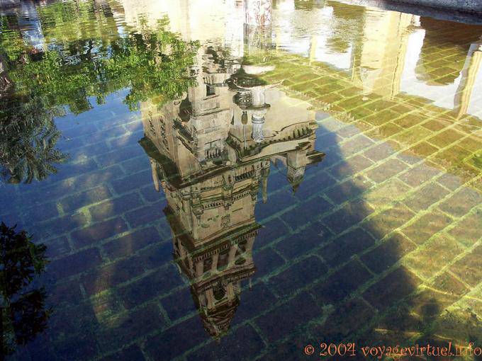Reflection of the minaret of the Giralda tower Torre Campanario, Mezquita Cordoba - Spain, Andalusia