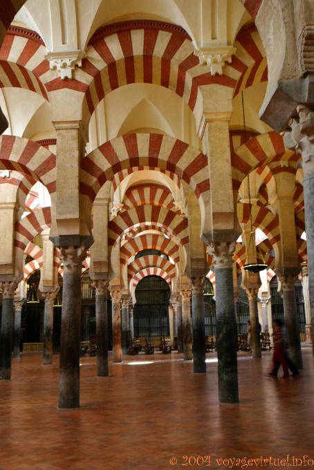 The color of the arcades is due to the mixture of white stone and brick red, Mezquita Cordoba - Spain, Andalusia