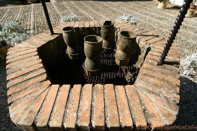 Crocks on wells, Patio del Pozo, Palacio de Viana - Spain, Andalusia