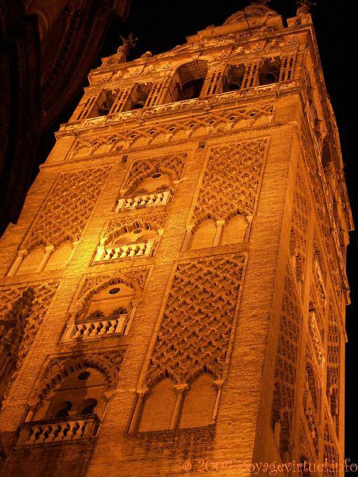 Close-up of the Giralda illuminated at night, Seville Cathedral - Spain