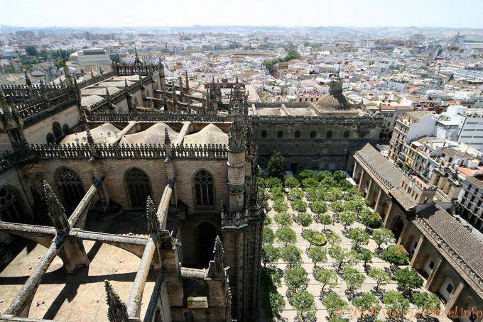 View of the Patio de los Naranjos and the Puerta del Perdon from the top of the Giralda, Seville Cathedral - Spain