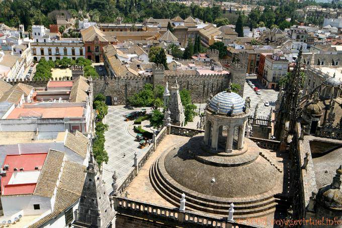 Look at the Plaza del Patio Bandera left, Plaza del Triunfo and walls from the Giralda, Seville Cathedral - Spain