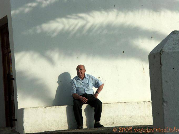 Old sitting on a bench, Vejer de la Frontera - Spain, Andalusia
