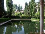 Reflection in a pool, Alhambra Nasrid Granada, Spain.