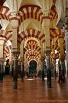 The color of the arcades is due to the mixture of white stone and brick red, Mezquita Cordoba, Spain.