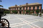 Pink facade of the Palacio Arzobispal on the place of Triunfo, Seville, Spain.
