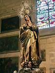 Statue of the Virgin walking on three heads, Seville Cathedral, Spain.