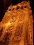 Close-up of the Giralda illuminated at night, Seville Cathedral, Spain.