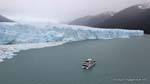 Boat before the ice cliffs south side, Perito Moreno Glacier, El Calafate, Argentina.