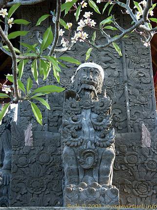 Statue in front of the relief Maduwe Karang - Bali