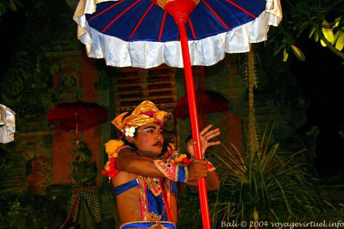 Game with umbrella Balinese Barong dance Ubud - Bali