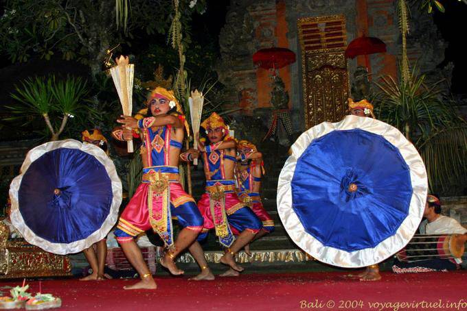 Open umbrellas and Martial dancers, Barong Ubud - Bali