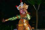 Dancer with gold embroidered dress and headdress decorated with flowers, Barong dance, Bali.