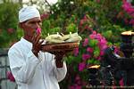 Priest and offerings to Uluwatu, Bali.
