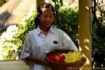 Young woman with flowers, Lovina, Bali.
