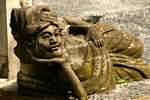 Statue meditative man lying, Ubud, Bali.