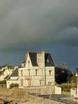 Rainbow sky on a Breton house Bénodet, Brittany, France.