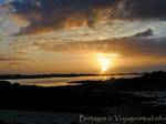 Or the sun setting over the peninsula and cove Perharidy Laber, Roscoff, Brittany, France.
