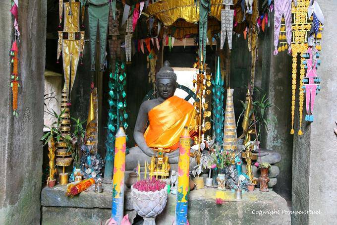 Of a seated Buddha gopuras, Banteay Kdei, Angkor, Cambodia