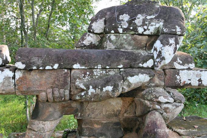 Sandstone ledge and stone giant, Victory Gate, Angkor, Cambodia