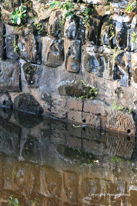 Heads carved wall moats, Preah Khan, Angkor, Cambodia