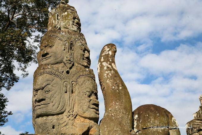 Stack of heads holding the tail of the fabulous snake, naga, moat, Angkor Thom, Angkor, Cambodia