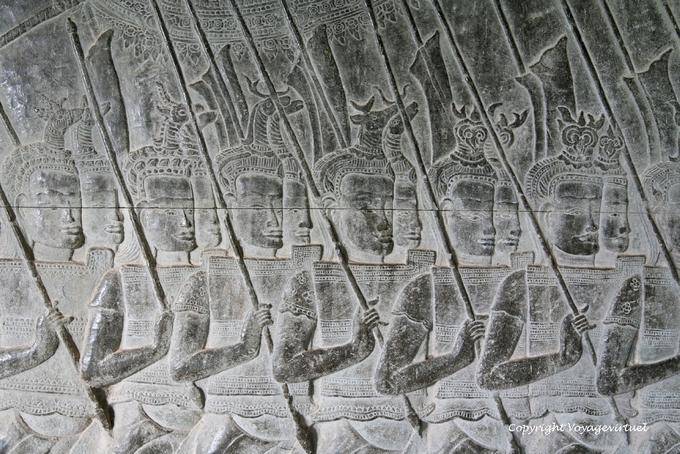 Soldiers marching with animal heads on their helmets, Angkor Wat, Angkor, Cambodia
