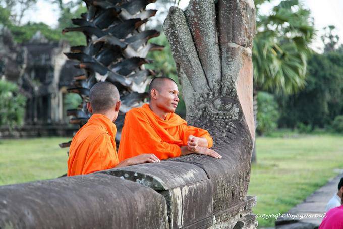 Daydreaming monks on a naga-off ramp, Angkor Wat, Angkor, Cambodia