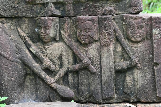 Characters parading sword in hand, bas-relief, Terrace of the Leper King, Angkor Thom, Angkor, Cambodia