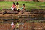 Kids on the edge of the moat Banteay Srei, Cambodia.