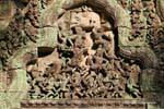 Carved pediment frantic tangled dancers Thommanon, Cambodia.