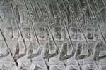 Soldiers marching with animal heads on their helmets, Angkor Wat, Cambodia.