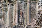 Aspara red head on one of the towers, Angkor Wat, Cambodia.