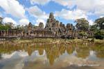 The Angkor Thom Bayon Site reflected in the pond, Cambodia.