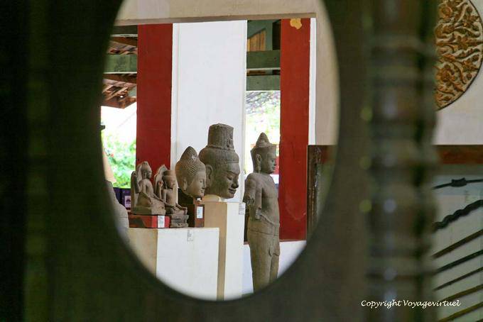Buddhas exhibition view through the window, Museum Phnom Penh - Cambodia