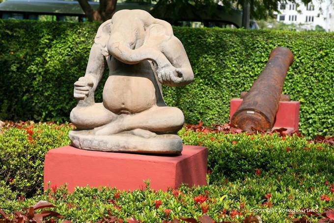 Ganesha sitting holding a radish in the right hand and a bowl in the left one, the National Museum, Phnom Penh - Cambodia