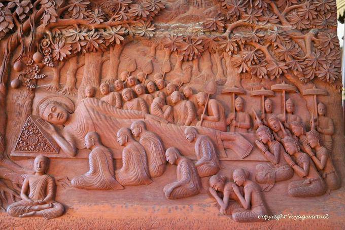 Woodcarving, reclining Buddha about to enter parinirvana, Wat Preah Keo, Phnom Penh - Cambodia