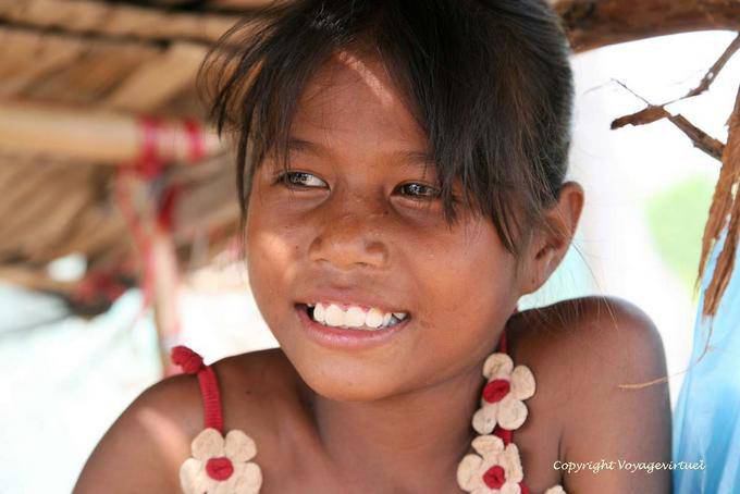 Smiling young saleswoman, Skun - Cambodia