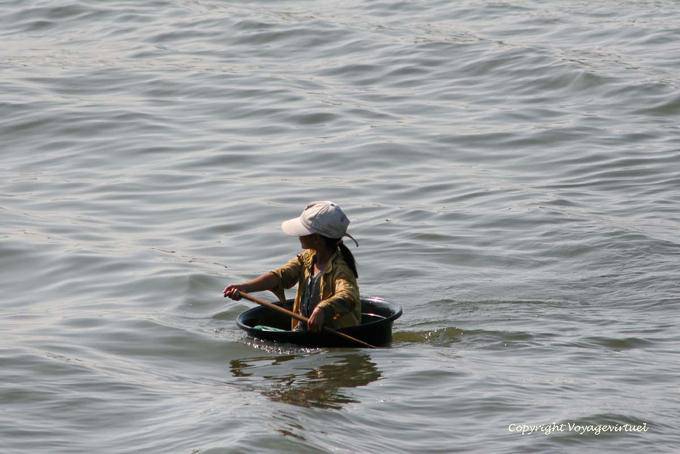 Girl embarked on a small boat, Tonle Sap - Cambodia