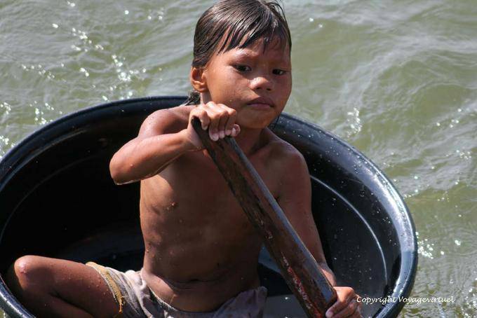 Cabin boy in a plastic bowl, Tonle Sap Lake - Cambodia