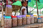Girl selling prahoc to Kompong Cham, Cambodia.