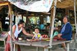Smiles in a shop, N7 National Highway, Cambodia.