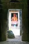 Modern Buddha in the pre-Angkorian temple of Wat Nokor, Kampong Cham, Cambodia.