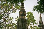 Sandstone peak surmounted by a Buddha head facing the cardinal points, Nokor Bachey, Kampong Cham, Cambodia.