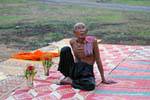 Character on colorful mats, Wat Nokor, Kampong Cham, Cambodia.