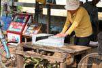 Ice cutting with a saw, Kracheh (Kratie), Cambodia.