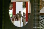 Buddhas exhibition view through the window, Museum Phnom Penh, Cambodia.