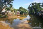 Reflections in the calm river Siem Reap, Cambodia.